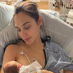 Gal Gadot holding her newborn baby, Ori, after recovering from a health crisis.