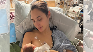 Gal Gadot holding her newborn baby, Ori, after recovering from a health crisis.